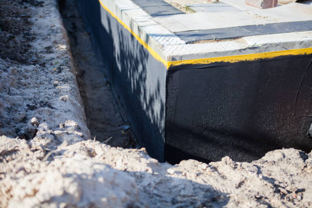 Professional Waterproofing technician working in Rex, GA